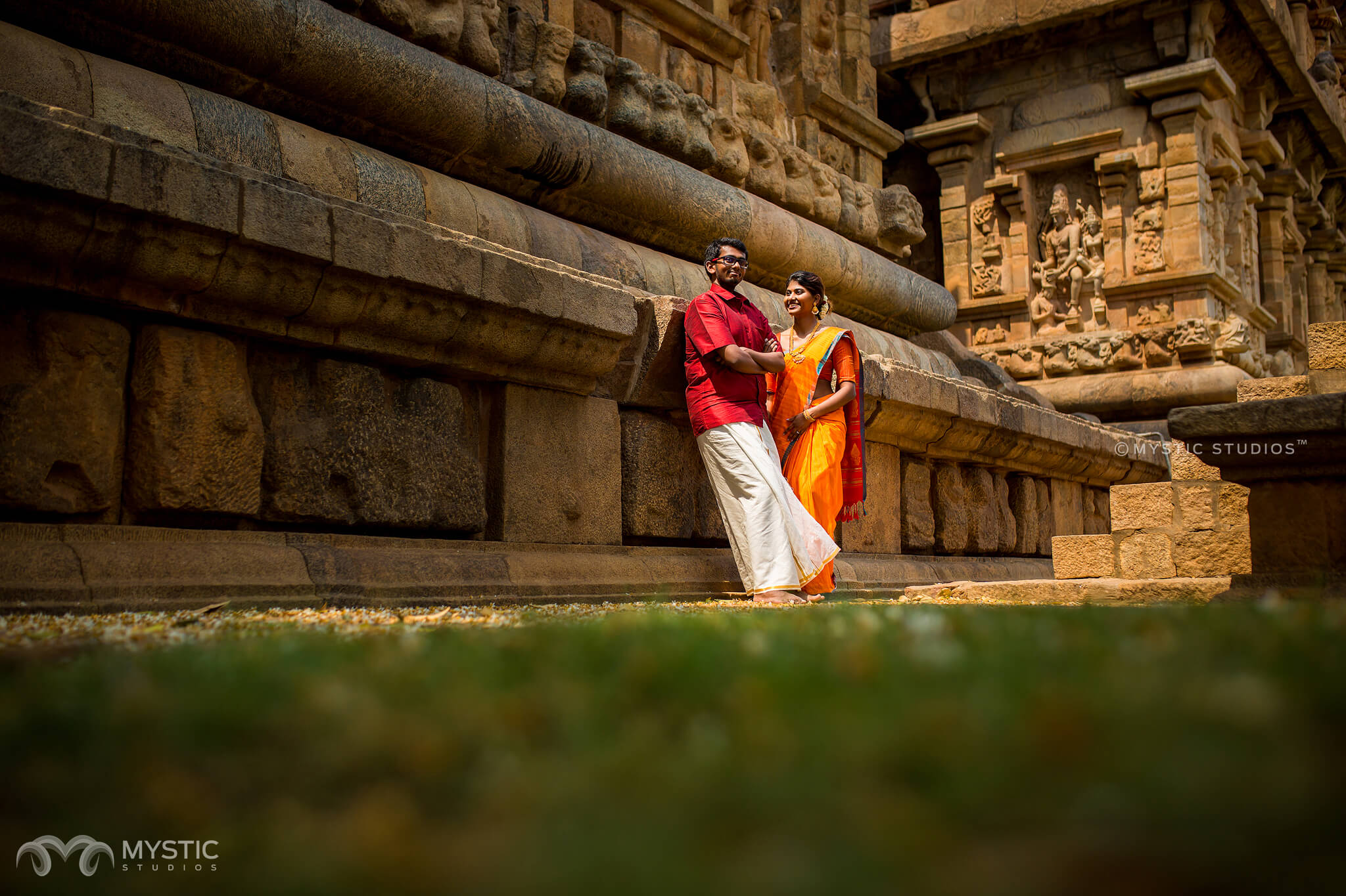 Boy Brahman - A young brahman poses in front of the Bhutanatha Temple and  water tank in Badami. - Badami, Karnataka, India - Daily Travel Photos -  Once Daily Images From Around