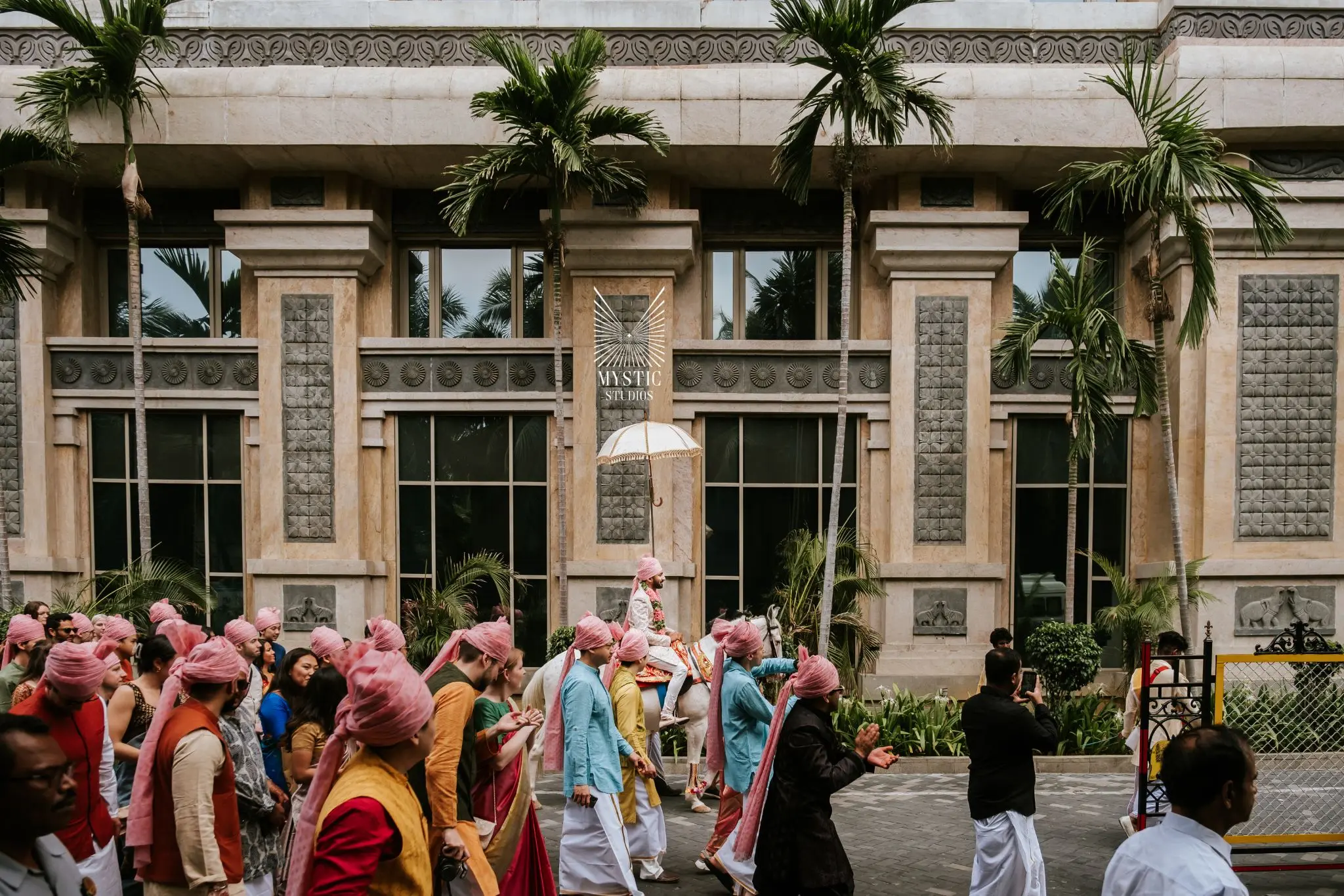 Destination wedding in ITC Grand chola baraat ceremony photographed in candid elegance by Mystic Studios.