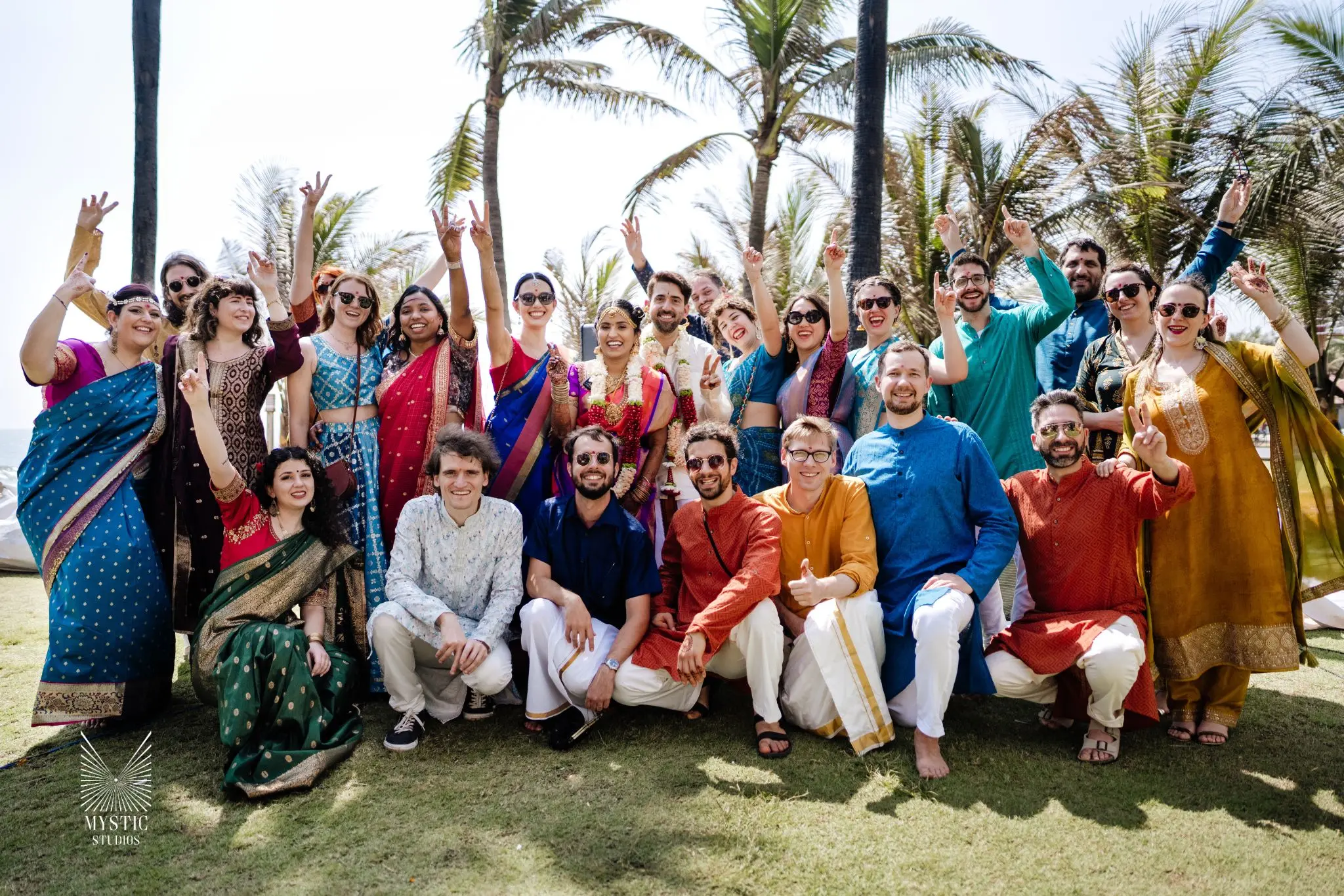 Intimate beachfront wedding in Kerala, family and friends photographed in candid elegance by Mystic Studios